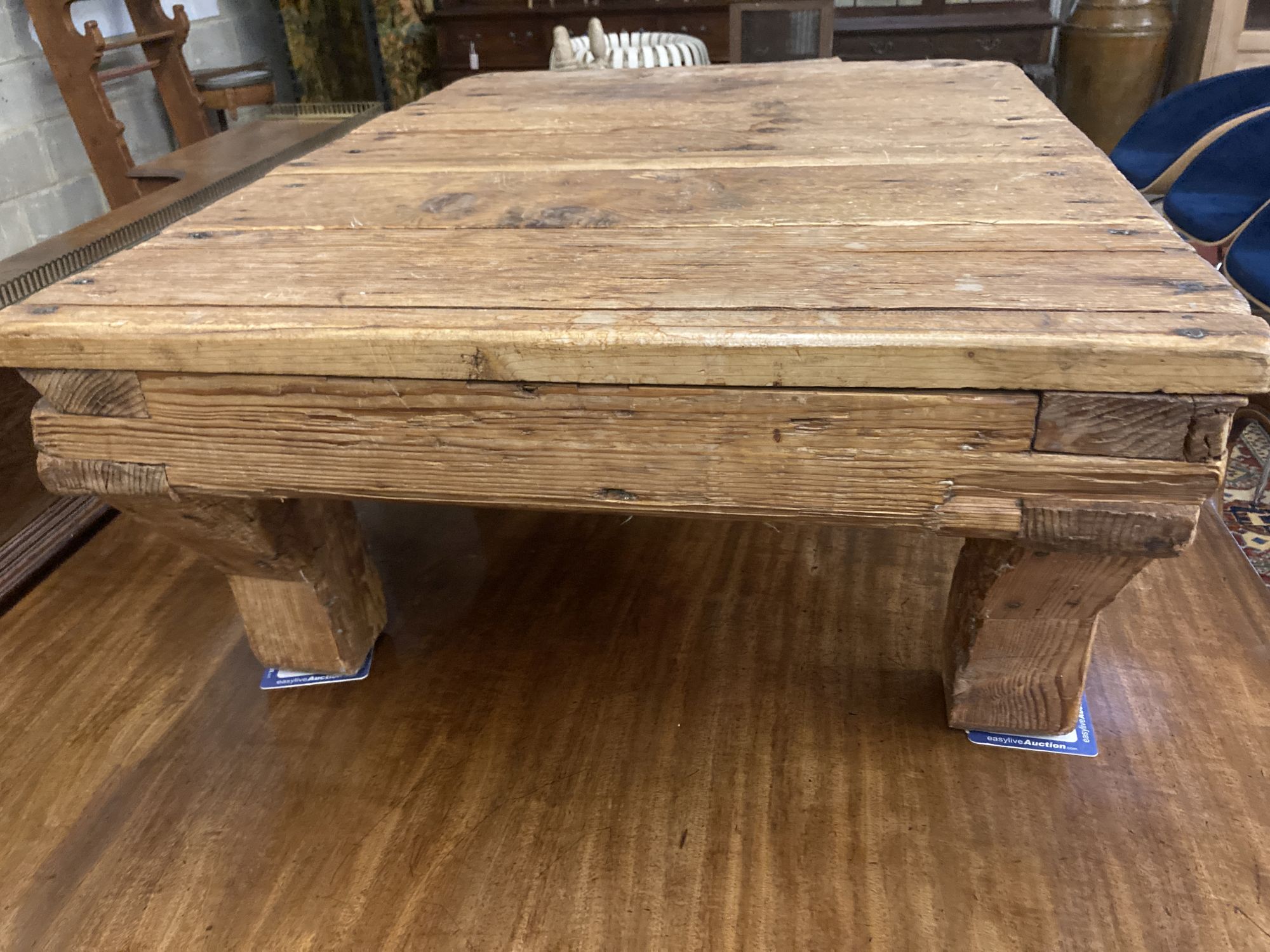 A 19th century provincial pine low dairy table, width 94cm depth 71cm height 39cm